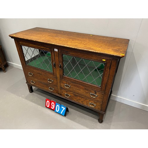 907 - Oak mirrored back sideboard/display cabinet with leaded glass doors with drawers