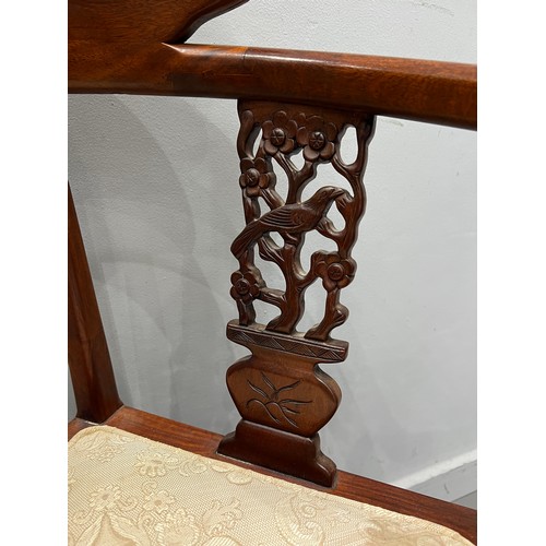 911 - Oriental carved wood elbow chair with bird depictions