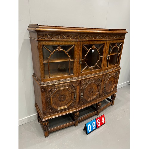 984 - Quality antique oak carved astral glazed cabinet on pineapple leg good colour