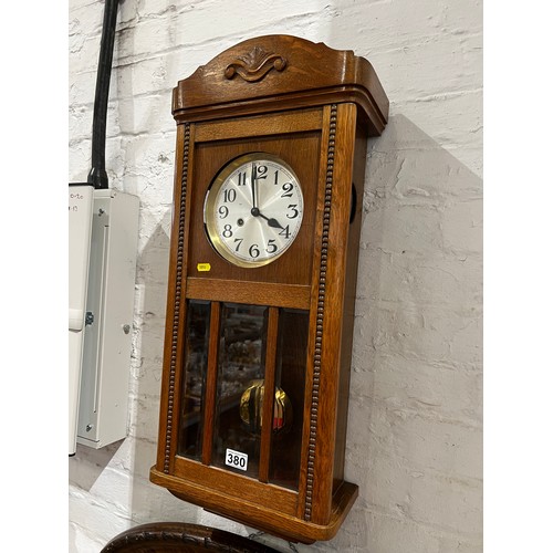 380 - Oak wall clock in good clean condition