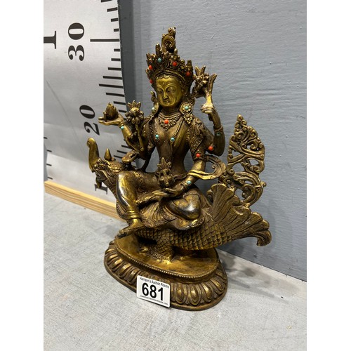 681 - Gilt bronze god figure on bird