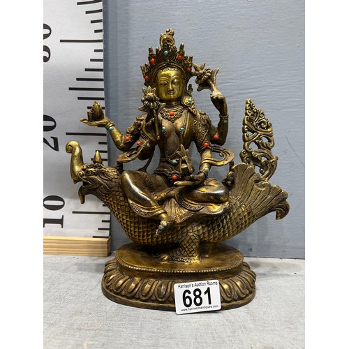 681 - Gilt bronze god figure on bird