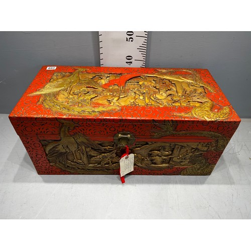 693 - Oriental red laquer camphor wood chest well carved