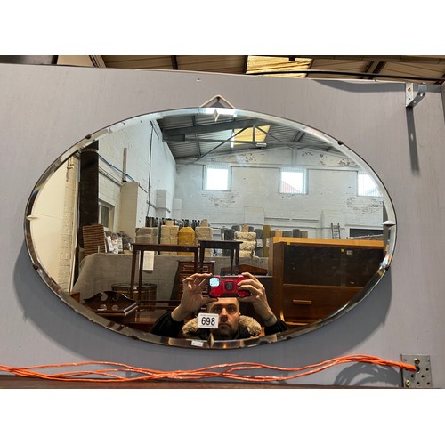 698 - Oval bevelled edge wall mirror