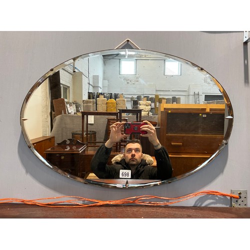 698 - Oval bevelled edge wall mirror