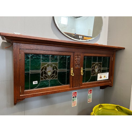 700 - Art nouveau oak wall cupboard with leaded glass double doors