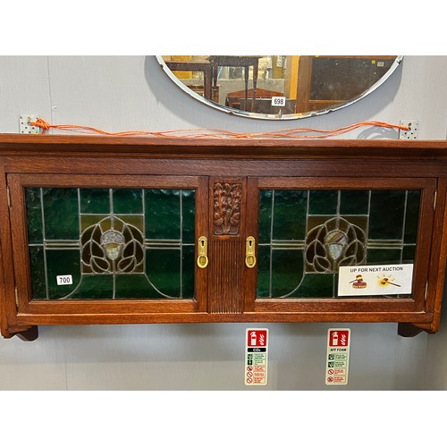 700 - Art nouveau oak wall cupboard with leaded glass double doors