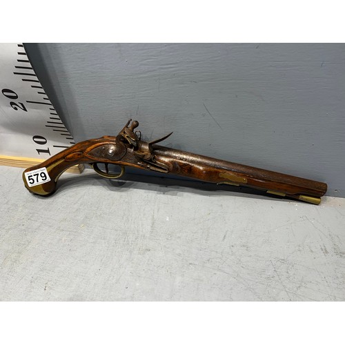 579 - Flintlock pistol with brass lion head on butt