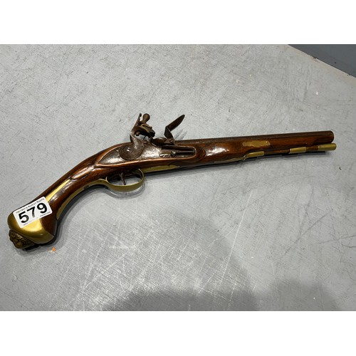 579 - Flintlock pistol with brass lion head on butt