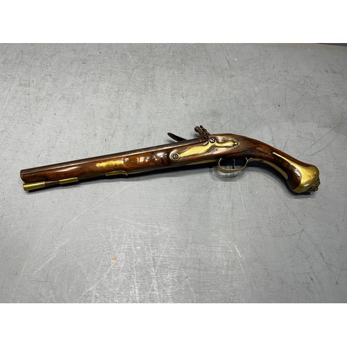 579 - Flintlock pistol with brass lion head on butt