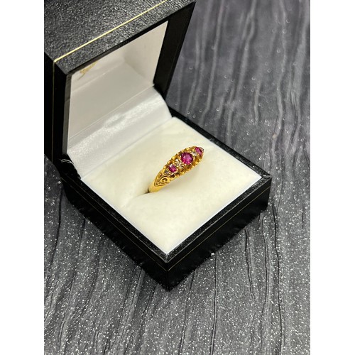 505 - 18ct gold + diamond + ruby ring. Size O. 3.1g gross weight