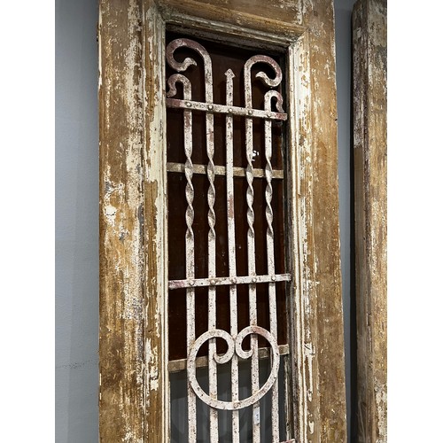 955N - Pair of early French doors with wrought iron panels
glass a/f
565mm x 2315mm