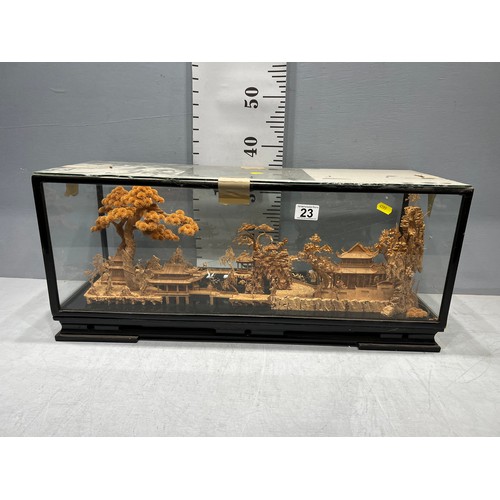 23 - Oriental cork display under glass