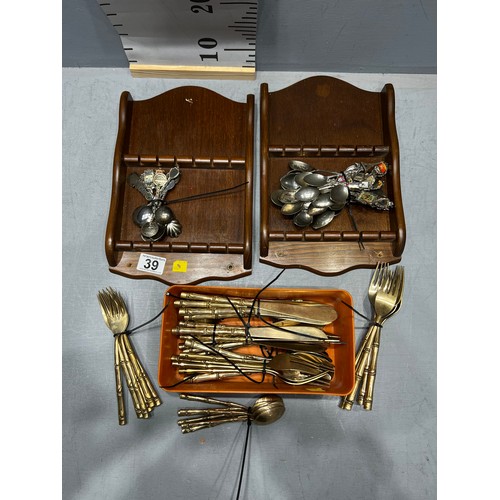 39 - Fifty four pieces bronze cutlery with bamboo design handles + souvenir spoons & racks