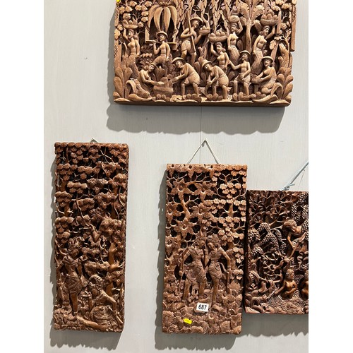 687 - Collection of 5 heavily carved oriental wall plaques