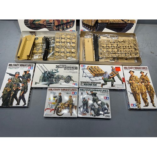 8 - 9 Assorted tamiya model kits challenger 1 tank, German panther tank, 5 military minitures, rocket la... 