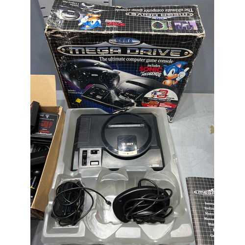 150 - Sega Megadrive games console + box games