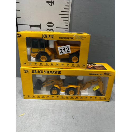 212 - 2 boxed JCB die cast toys