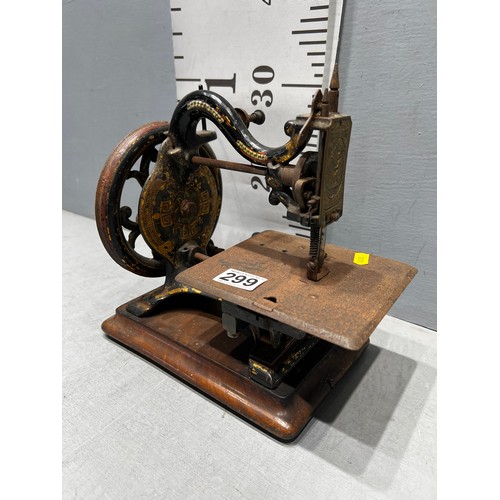 299 - Victorian miniature sewing machine with original label