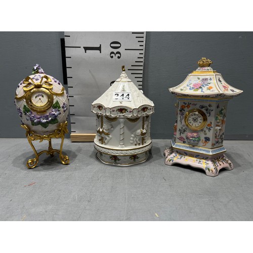 344 - Musical royal Albert carousel + egg on stand, clock + oriental clock