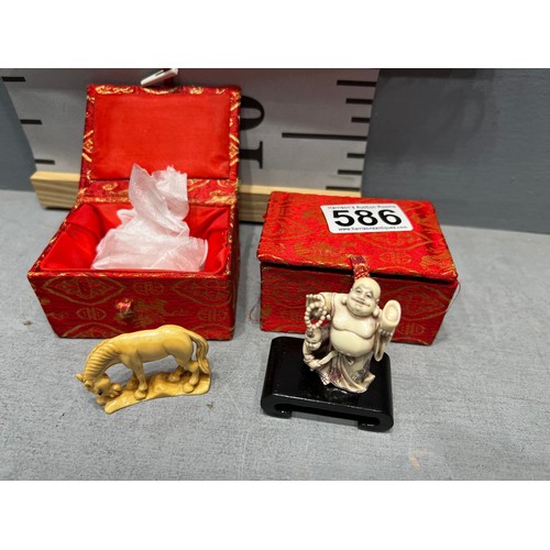 586 - 2 boxed oriental figures