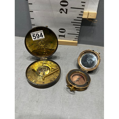 594 - 2 brass compasses