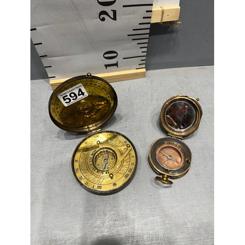 594 - 2 brass compasses