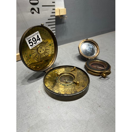 594 - 2 brass compasses