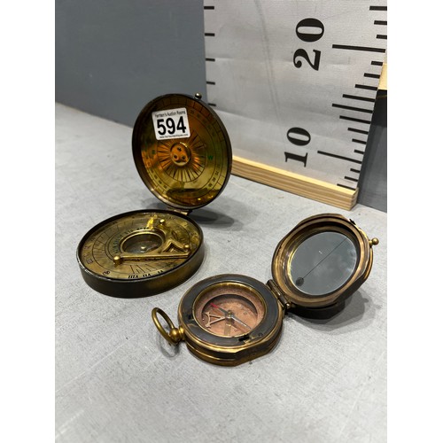 594 - 2 brass compasses