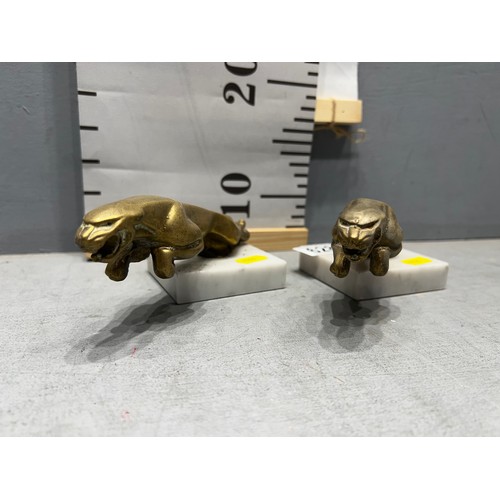 628 - Pair of early solid brass Jaguar car mascot on plinths