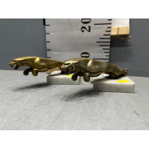 628 - Pair of early solid brass Jaguar car mascot on plinths