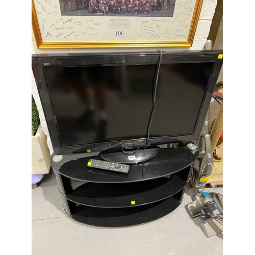 651 - Panasonic TV + remote on stand. In working order