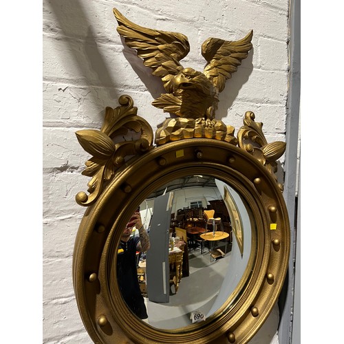 690 - Round gilt mirror with Eagle on top