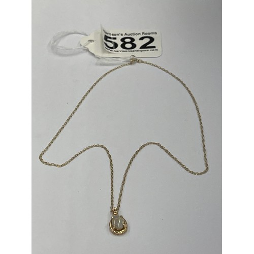 582 - 10ct gold pendant with opal on 9ct gold chain. pendant approx 0.7g gross. chain approx 0.6g gross