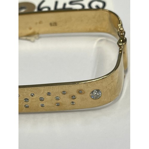 645Q - 9ct gold heavy bangle with 2 large + 20 small diamonds. approx 47.4g gross