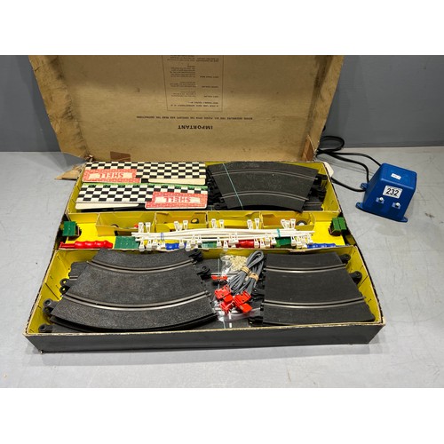 232 - Vintage boxed scalextric 4 in 1 motor racing set with power pack