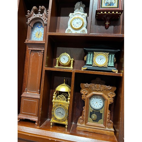 96 - Franklin mint 'The collectors treasury of clocks' in cabinet