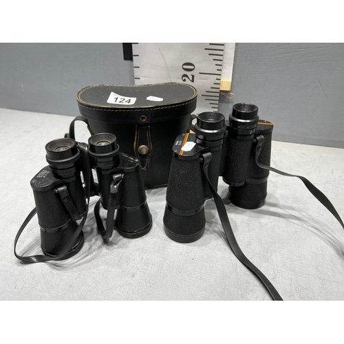 124 - 2 pairs binoculars. One in case