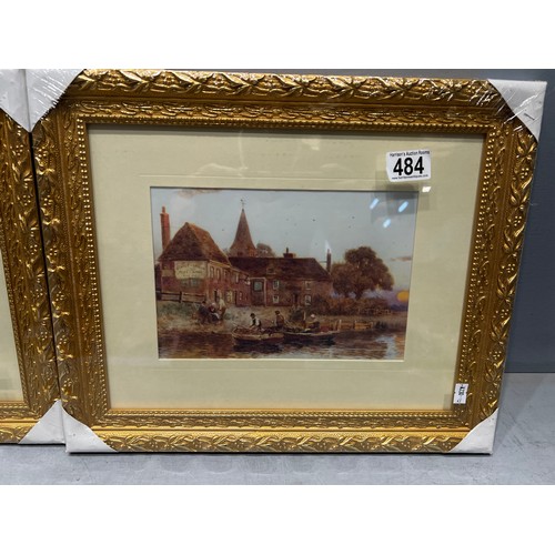 484 - 2 gilt framed pictures still in wrapping. 'Village Scenes'