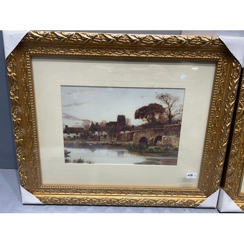 484 - 2 gilt framed pictures still in wrapping. 'Village Scenes'