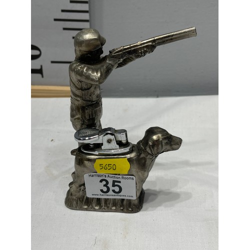 35 - Vintage shooting man + Hunting dog cigarette lighter