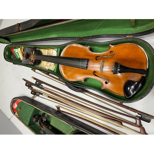 137 - 2 violins in cases + quantity bows