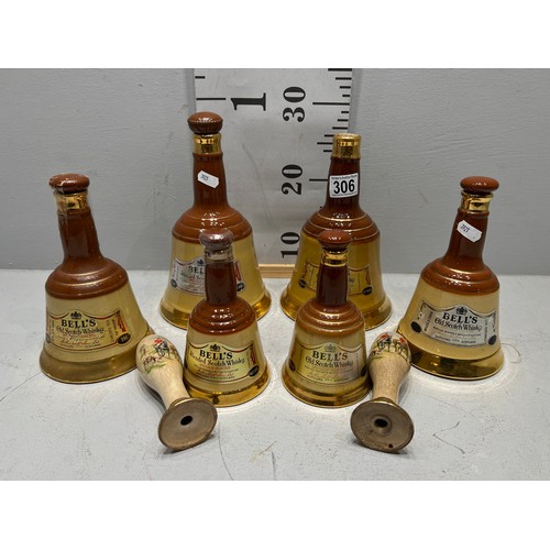 306 - 6 Bells whiskey decanters + pair beer pump handles