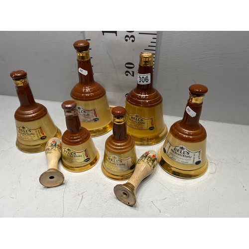 306 - 6 Bells whiskey decanters + pair beer pump handles