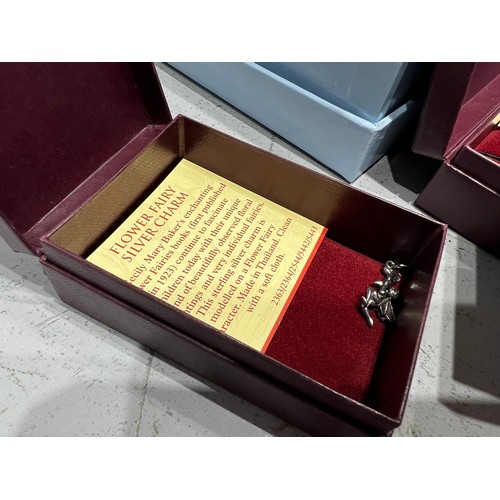 527 - Quantity boxed silver charms by Past Times