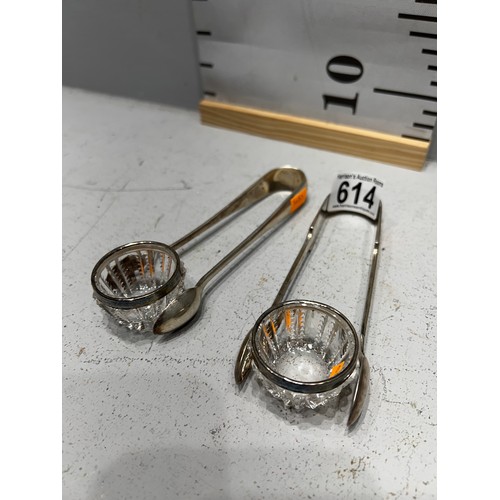 614 - Pair silver sugar tongs + pair silver rimmed salts. 176g gross