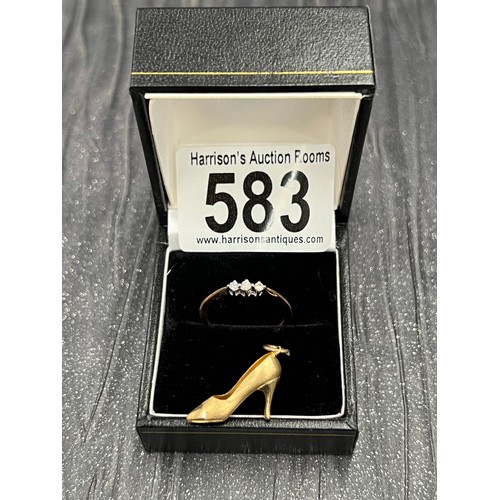 583 - 9ct gold ring with 3 stone diamond. Size N + 9ct gold shoe charm. 2.3g gross