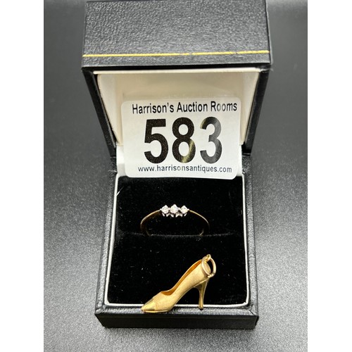 583 - 9ct gold ring with 3 stone diamond. Size N + 9ct gold shoe charm. 2.3g gross