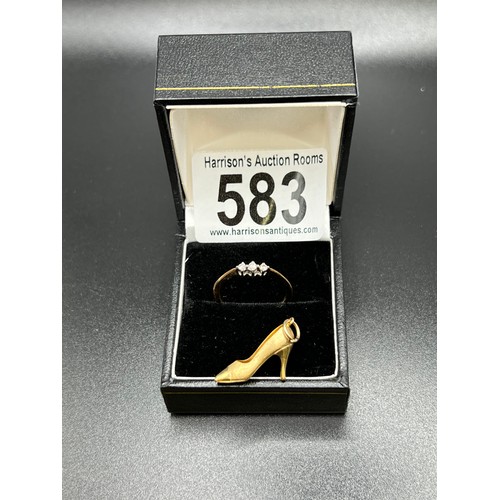 583 - 9ct gold ring with 3 stone diamond. Size N + 9ct gold shoe charm. 2.3g gross