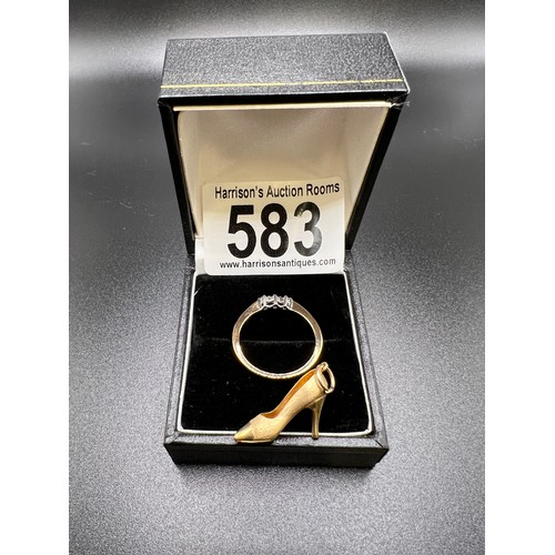 583 - 9ct gold ring with 3 stone diamond. Size N + 9ct gold shoe charm. 2.3g gross